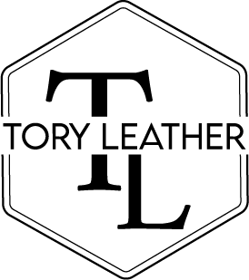 Tory Leather logo with TL monogram inside a hexagonal outline.